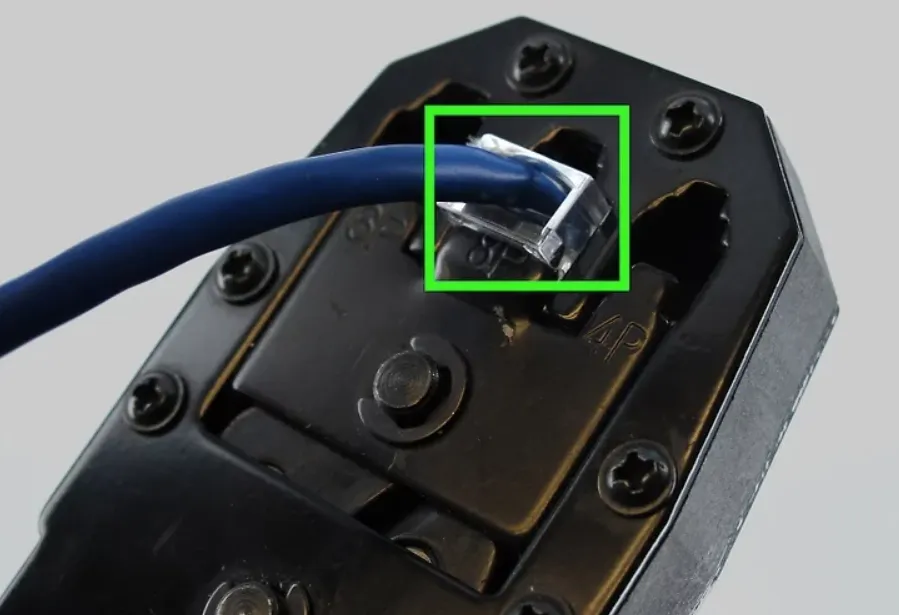 Crimping an RJ45 connector with a network crimp tool